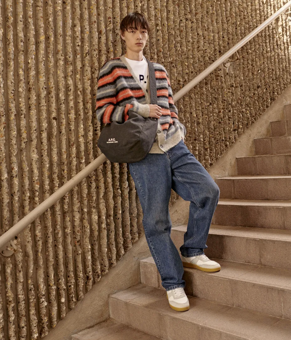 male model on stairs in apc clothing