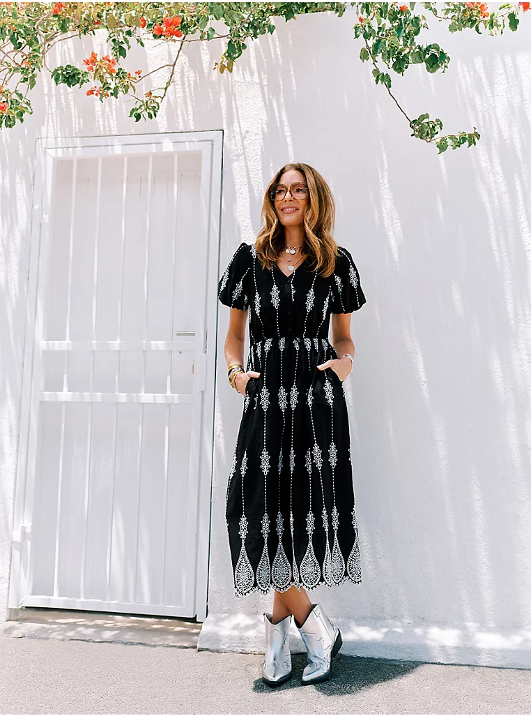 kat farmer in black and white print dress 