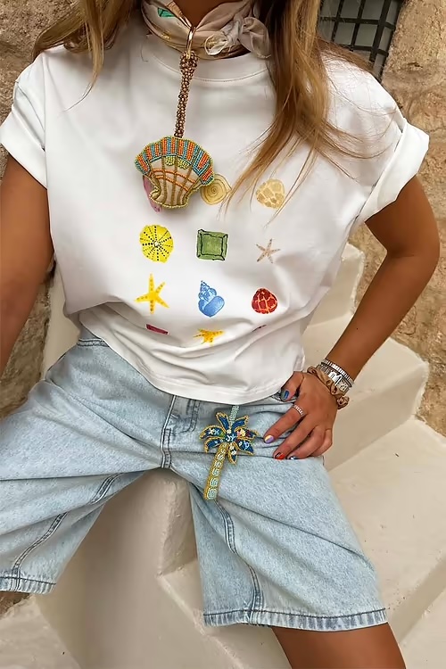 Caetana in white tshirt and denim shorts