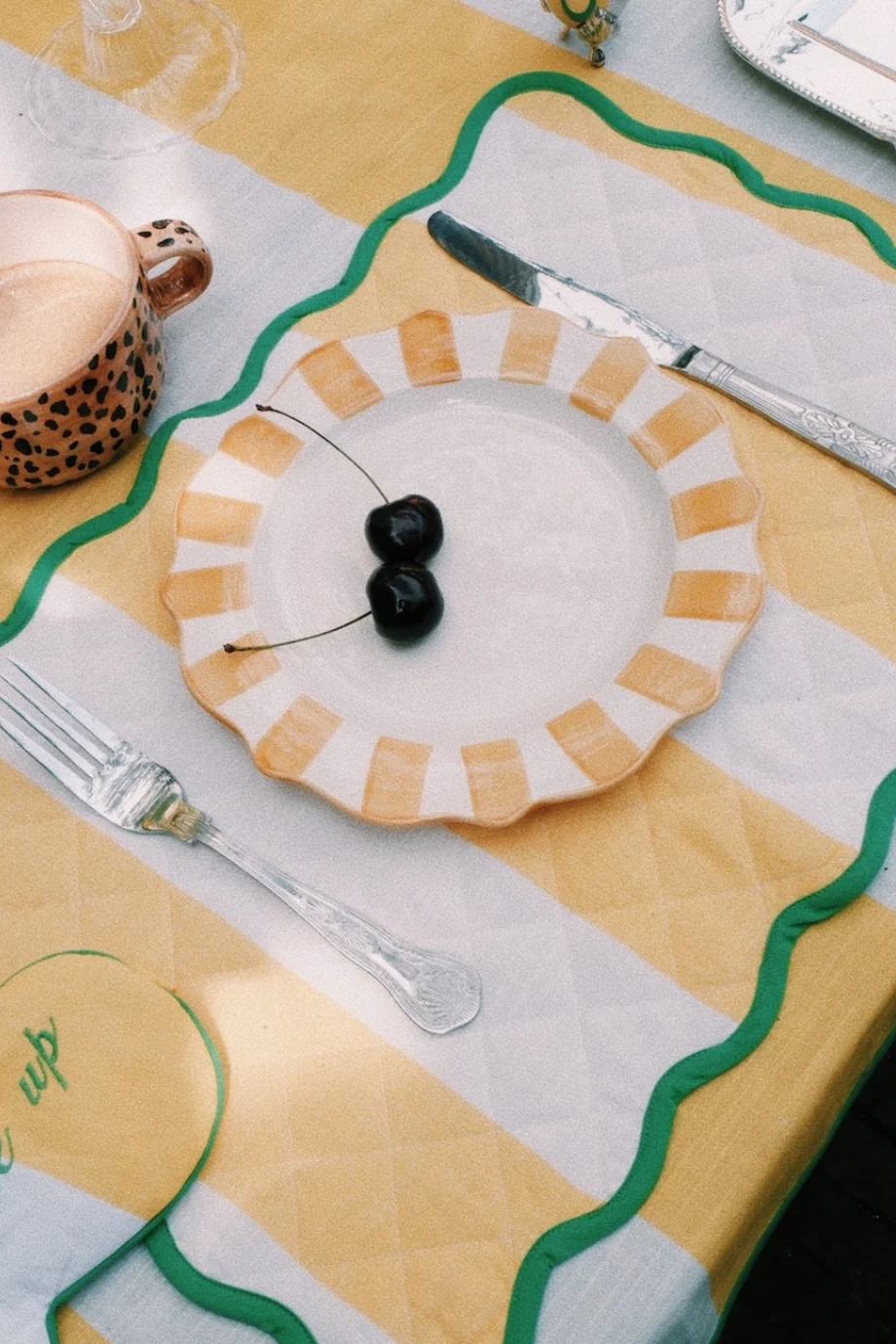 striped plate on striped table setting