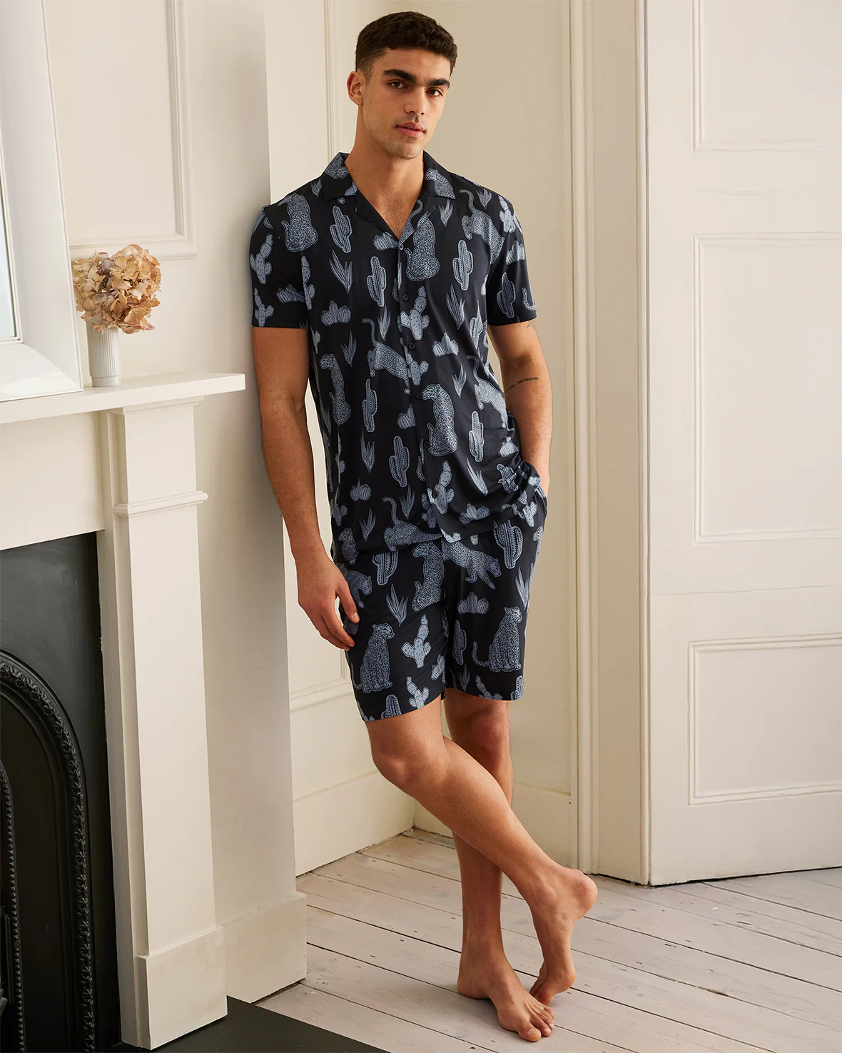 male model in navy leopard print pjs