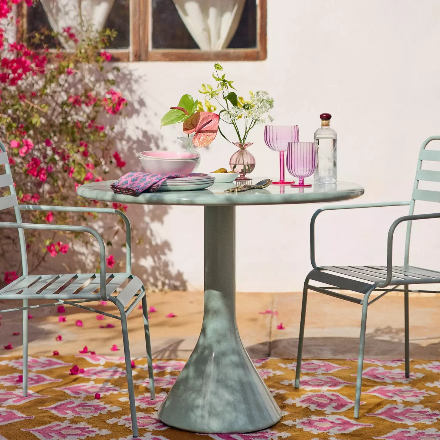 colourful bistro set and table set up on patio