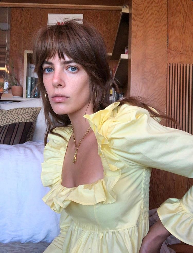 model wearing yellow ruffle blouse 