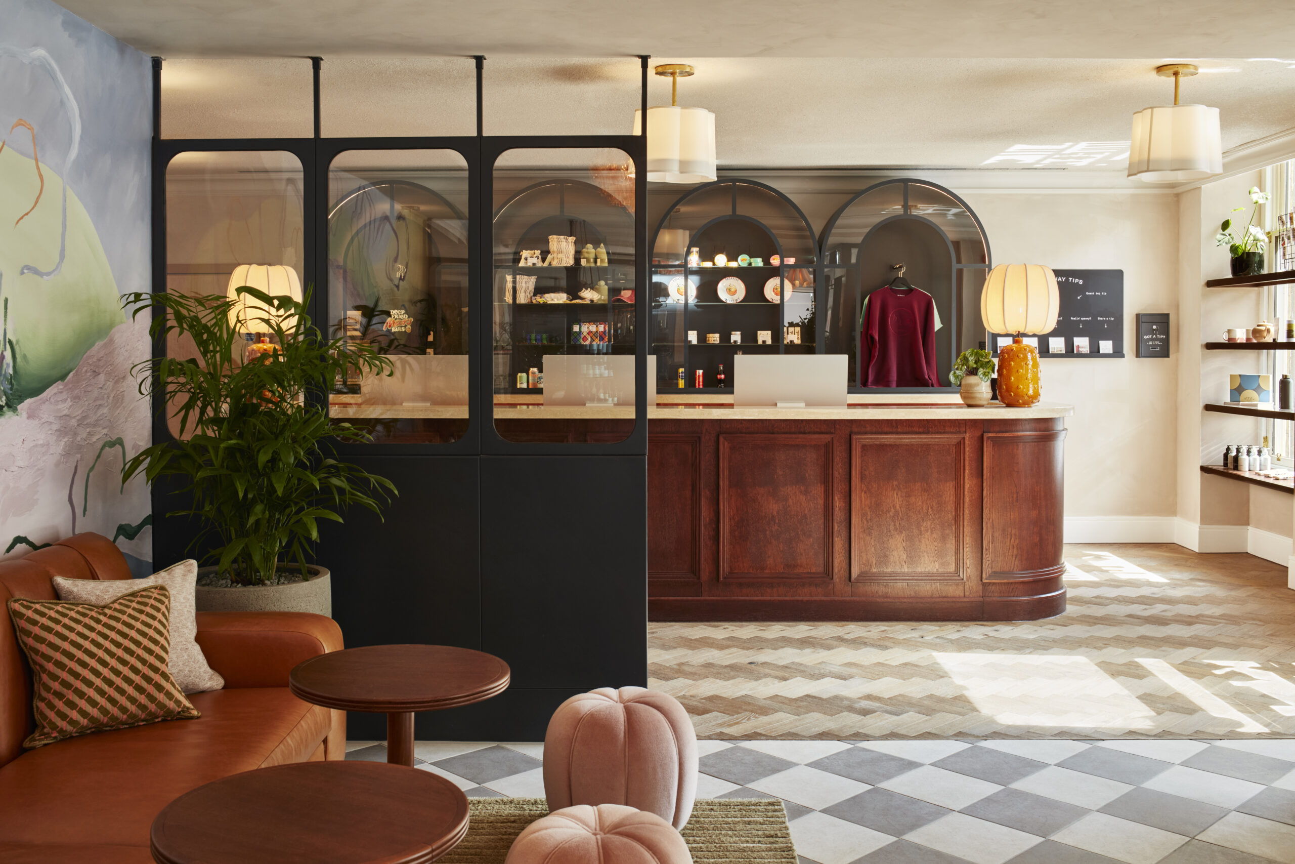 front desk in the foyer of the hoxton hotel with chairs