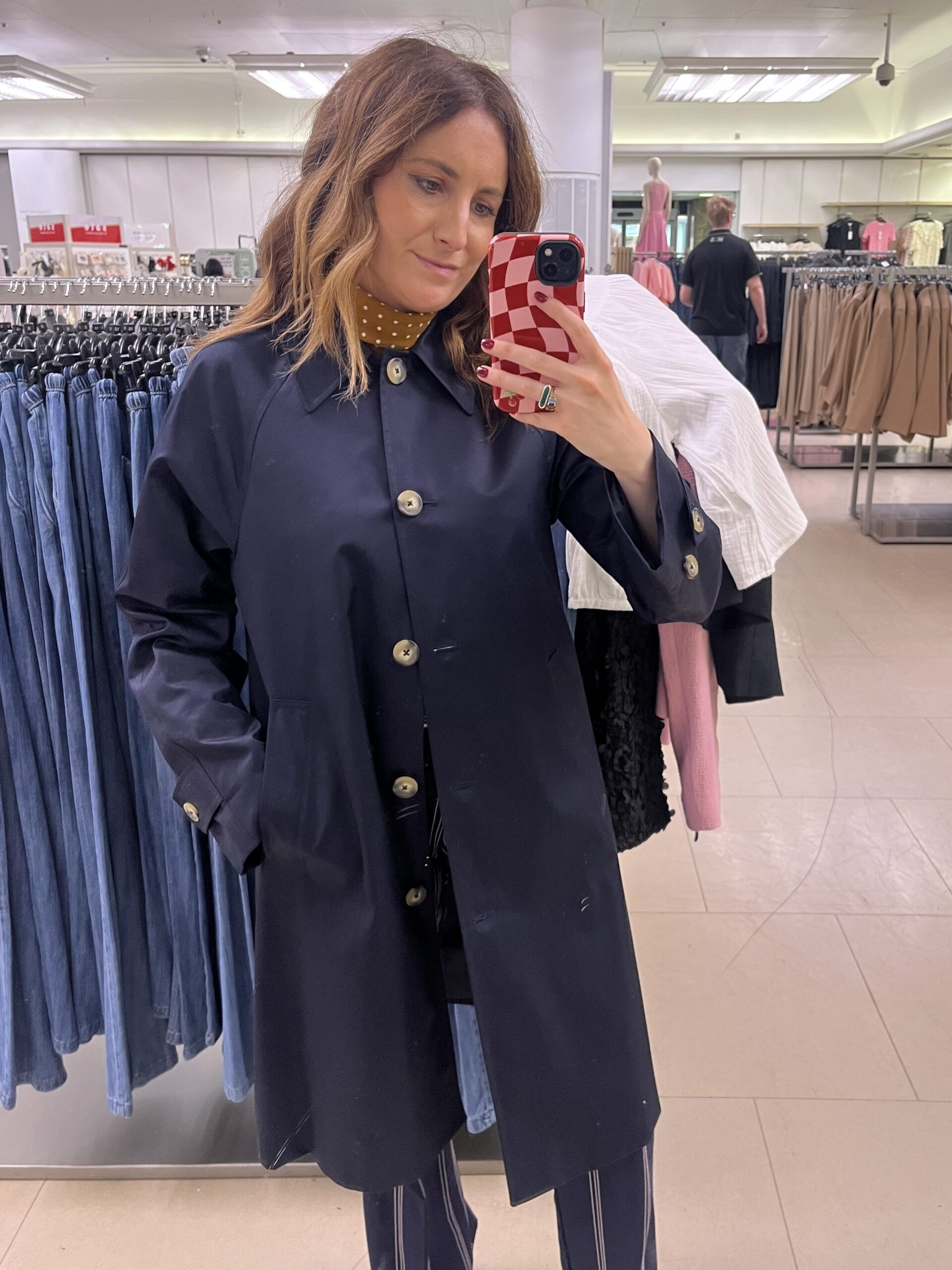 astrid wearing navy car coat 