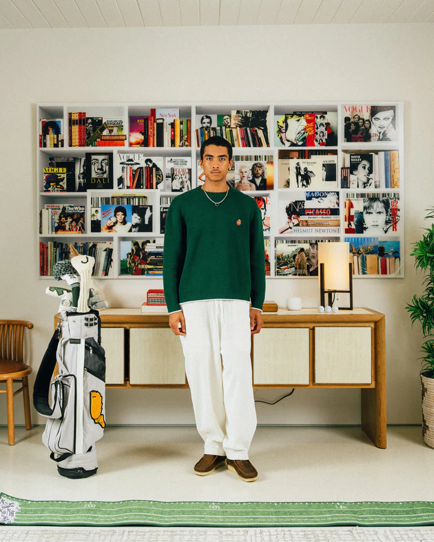 student golf campaign - male model wearing gold attire