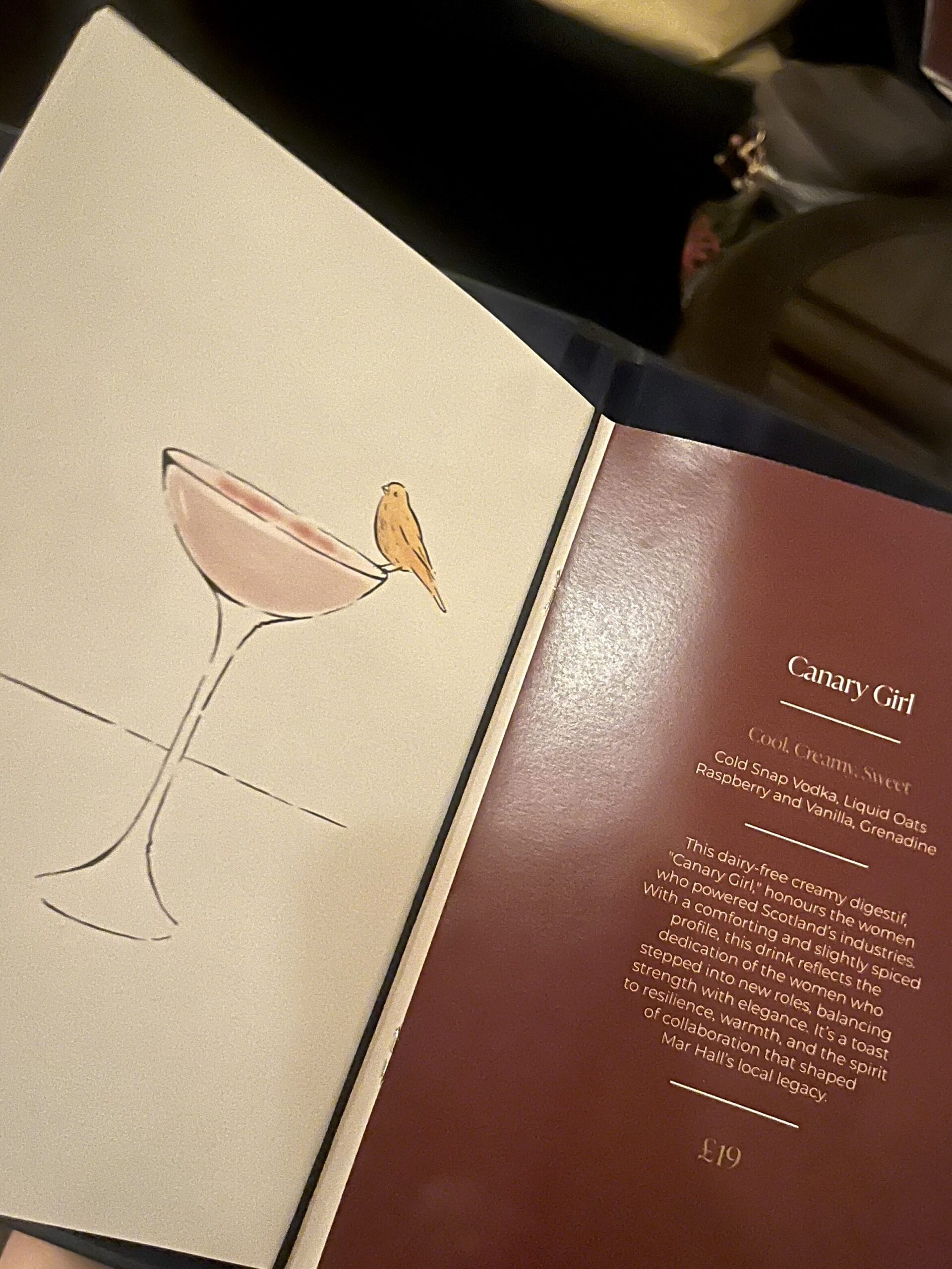 cocktail menu at Mar Hall with cocktail illustration and description 